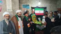 دیدار خادمان حرم امام رضا (علیه السلام) با خانواده شهید ابوالفضل سالاری نیک